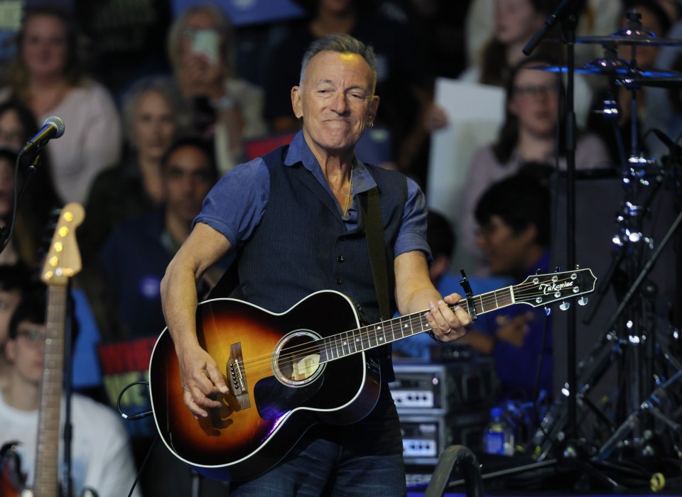 a man playing an acoustic guitar with a takamine guitar in the background