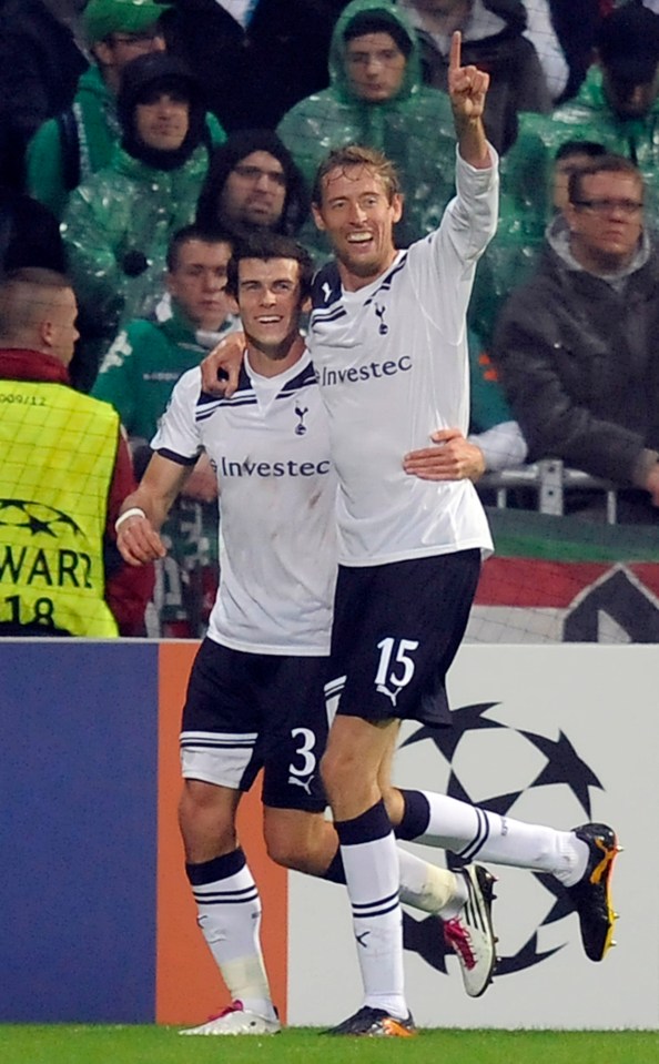 two soccer players wearing jerseys that say investec
