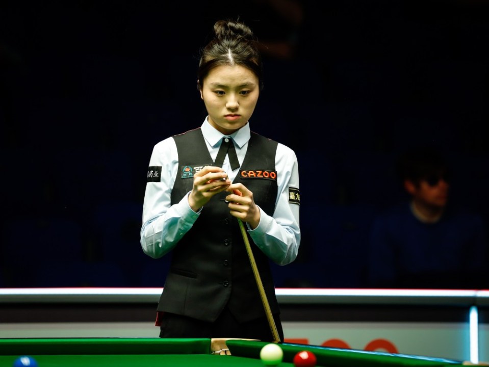 SHEFFIELD, ENGLAND - APRIL 08: Bai Yulu of China chalks the cue in the first round match against Jenson Kendrick of England on day one of 2024 World Championship Qualifiers at the English Institute of Sport on April 8, 2024 in Sheffield, England. (Photo by Tai Chengzhe/VCG via Getty Images)