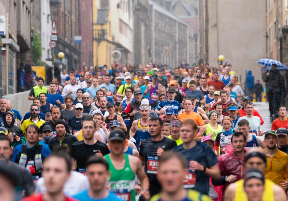 Many runners participating in a marathon in Edinburgh, Scotland.