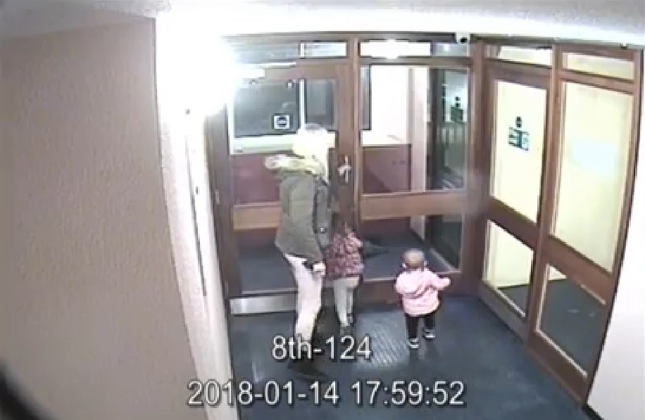 CCTV image of a woman with two young children entering a building hours before their deaths.