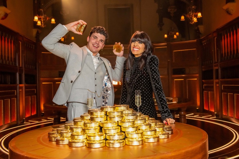 Harry and Claudia Winkleman, presenters of The Traitors II, with a large pile of gold coins.