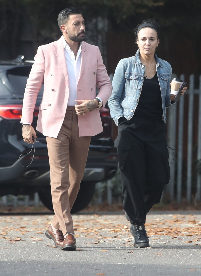 Giovanni Pernice and Amanda Abbington walking near a studio.