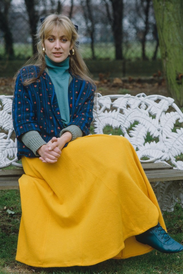 Portrait of Carol Royle in a yellow skirt.