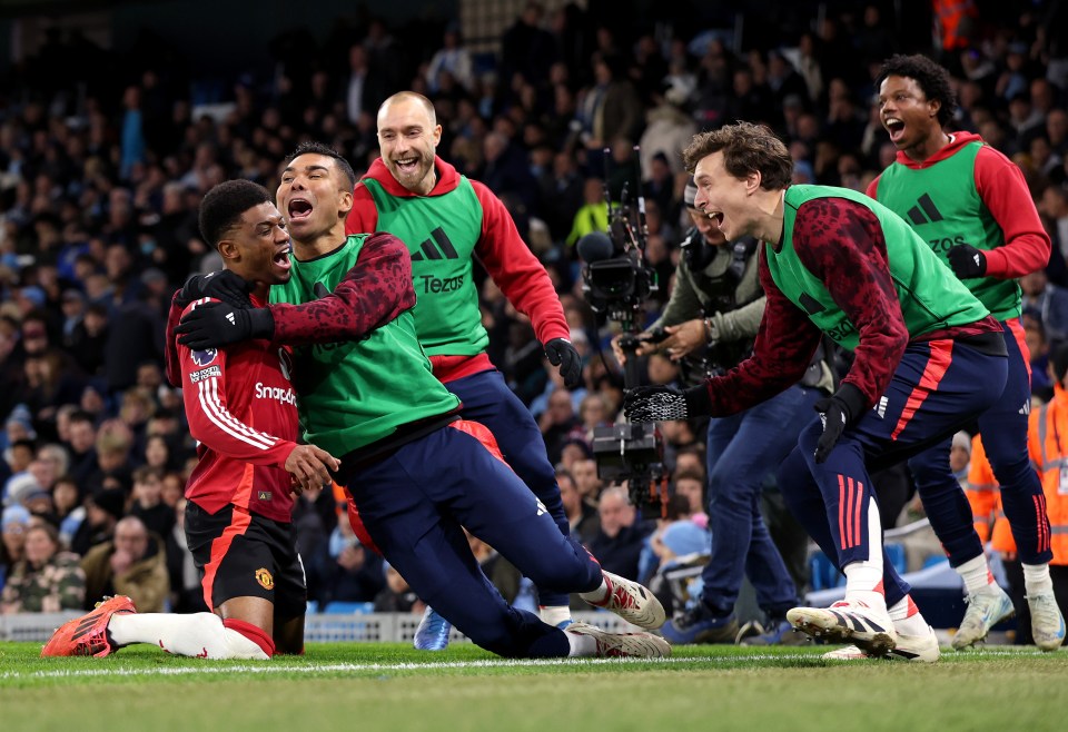 Amad Diallo of Manchester United celebrates scoring a goal with his teammates.