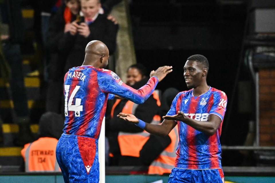 Crystal Palace's Jean-Philippe Mateta (#14) and Ismaila Sarr (#7) celebrate a goal.