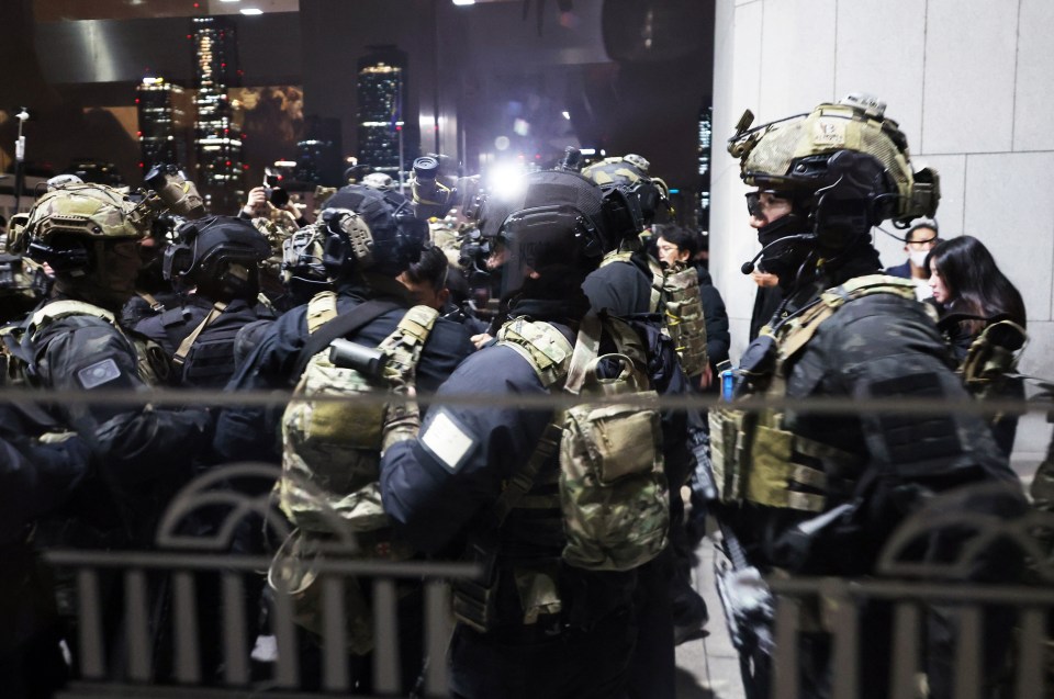 Soldiers prepare to enter the building in Seoul after the declaration of martial law