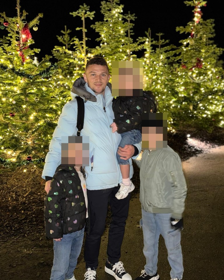Kieran Trippier with his three children in front of Christmas trees.