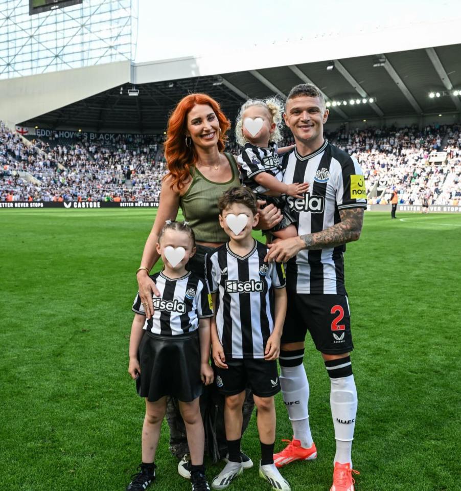 Kieran Trippier with his wife and three children at a football stadium.