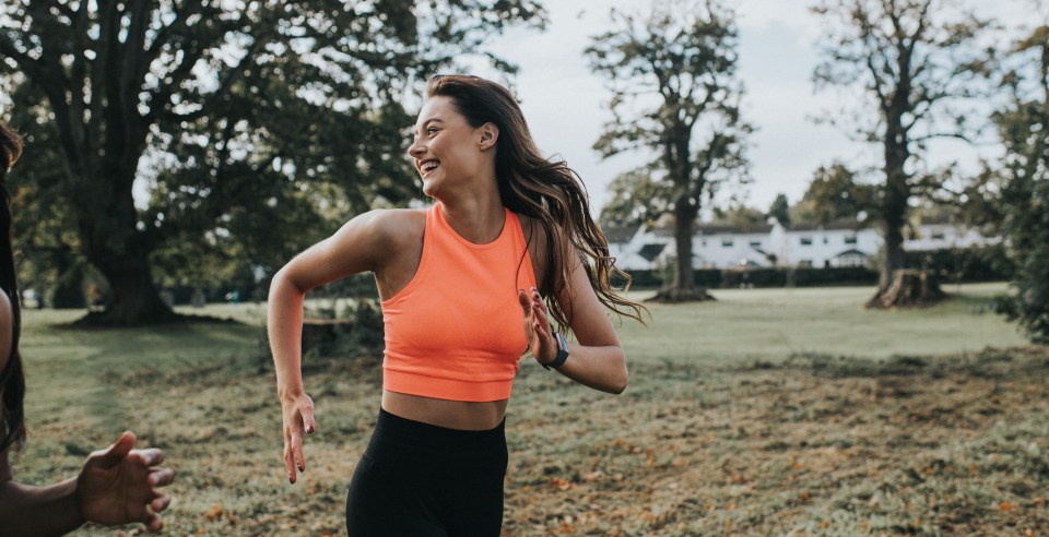 Woman jogging in a park.
