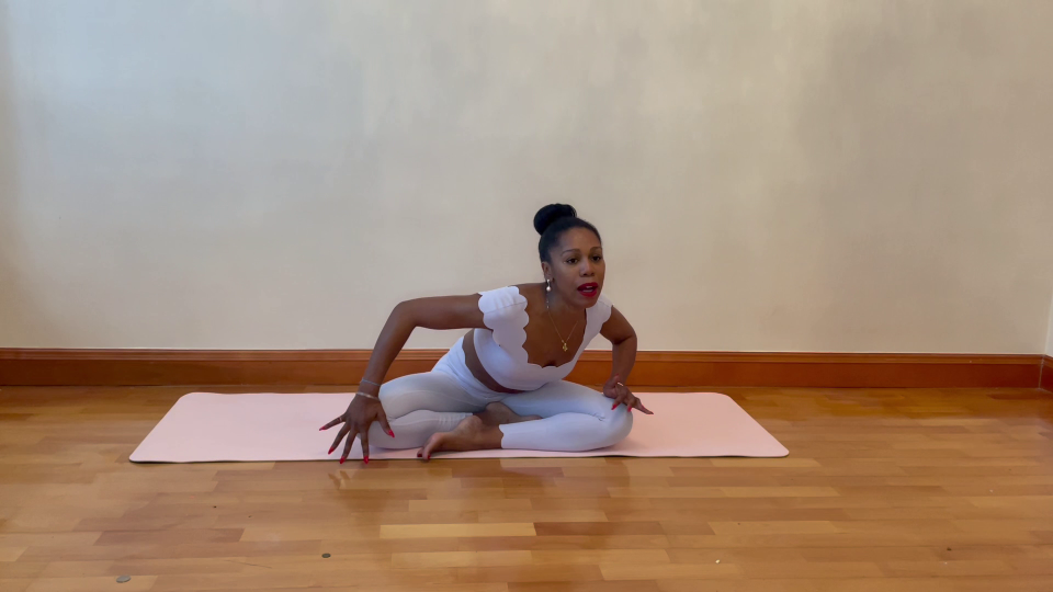 Woman demonstrating yoga stretches to relieve trapped wind.