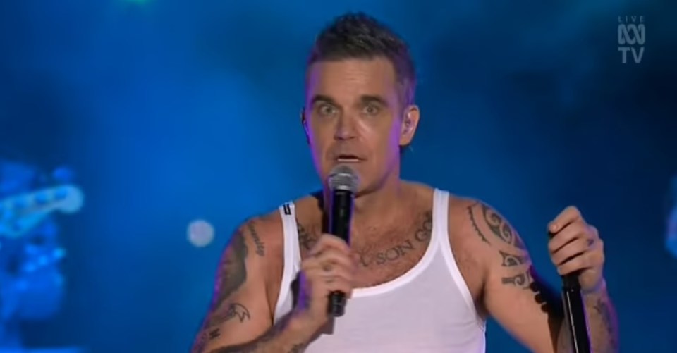 Robbie Williams calls out an audience member during a New Year's Eve concert in Australia.