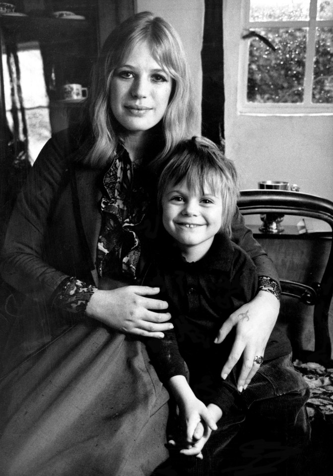 Black and white photo of Marianne Faithfull and her son Nicholas holding hands.
