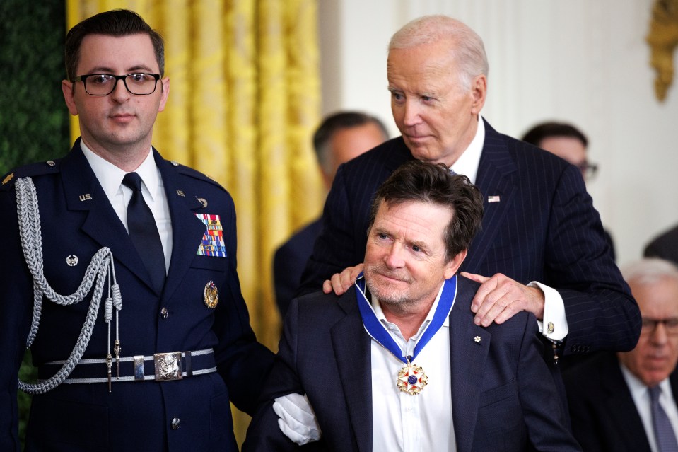Michael J. Fox receiving the Presidential Medal of Freedom from President Biden.