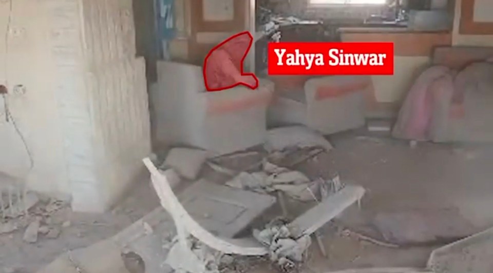 Drone image of Yahya Sinwar in a damaged building.