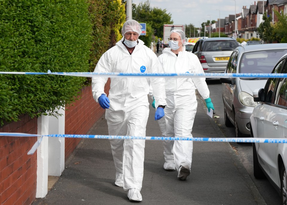 Forensic investigators at a crime scene.