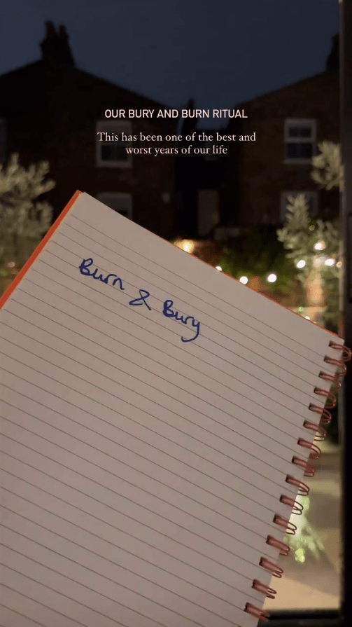 Notebook with "Burn & Bury" written on it; background shows houses at night.