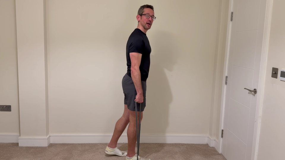 Man performing a resistance band exercise.