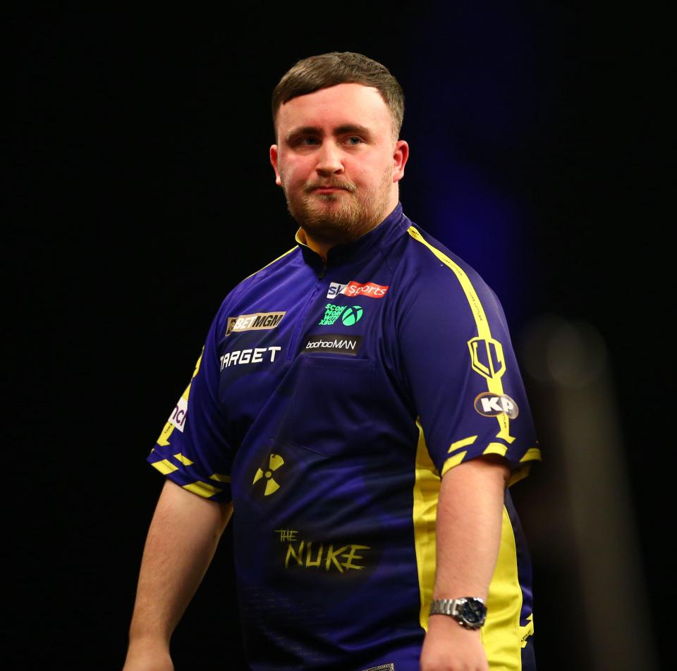 Luke Littler at a darts competition.