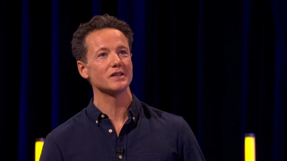 Man speaking on stage.
