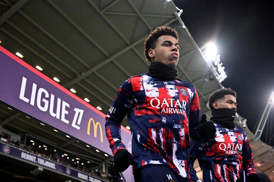 Paris Saint-Germain players warming up before a Ligue 1 match.