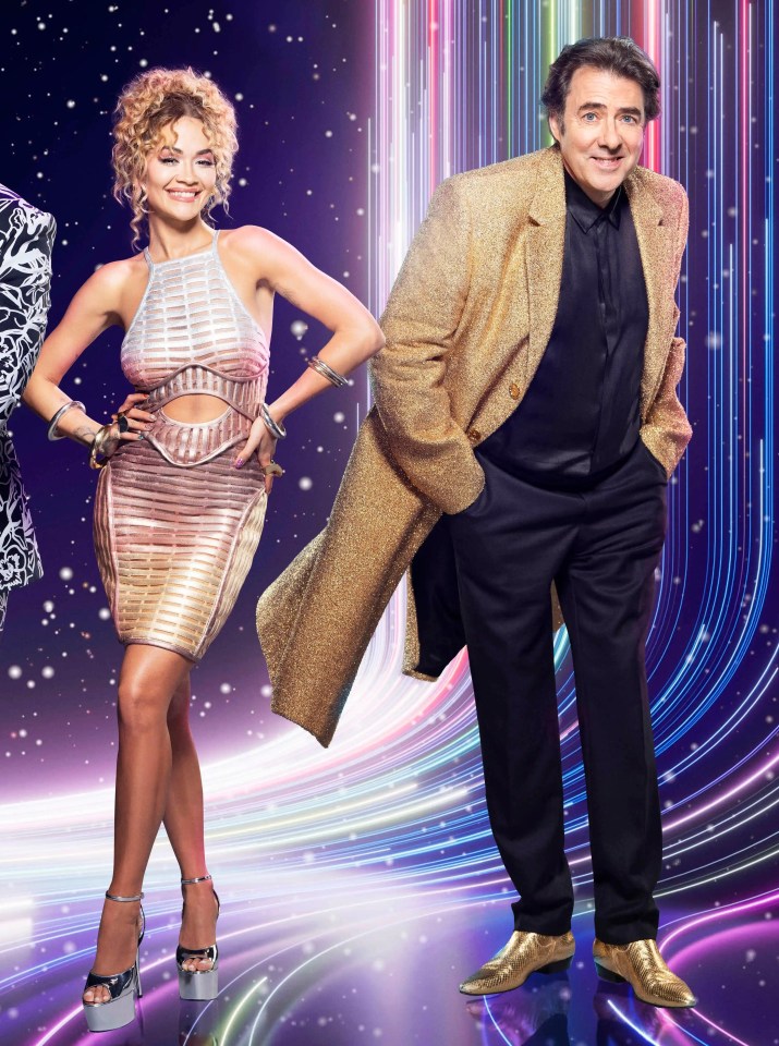 Promotional image of The Masked Singer judges: Mo Gilligan, Davina McCall, Joel Dommett, Rita Ora, and Jonathan Ross.