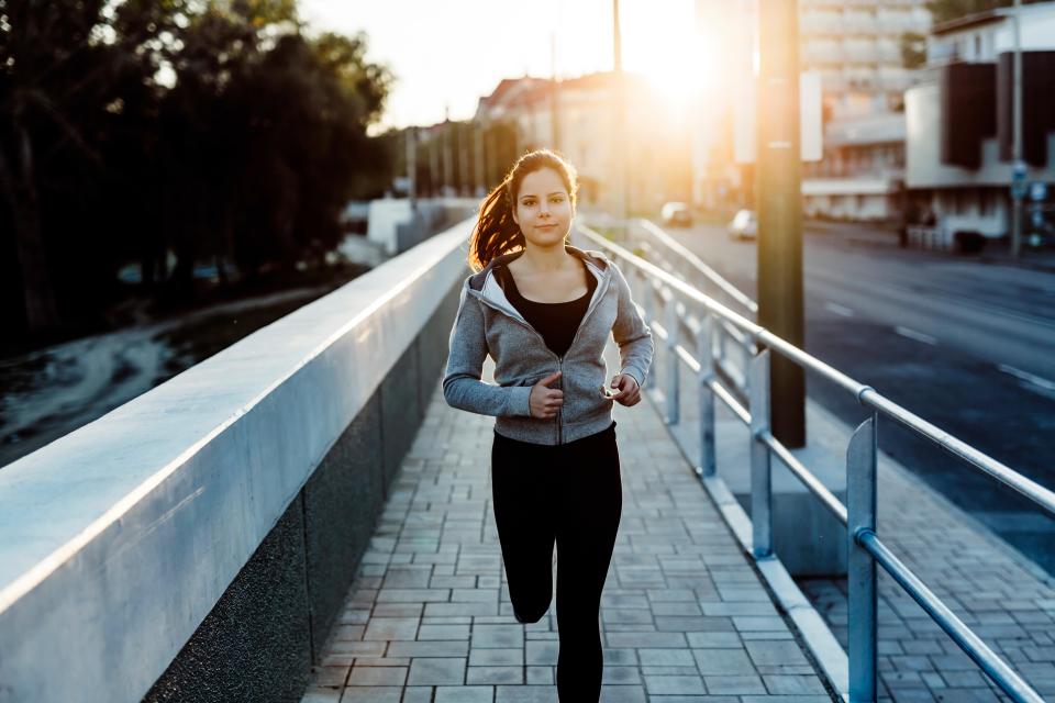 Woman jogging in city.