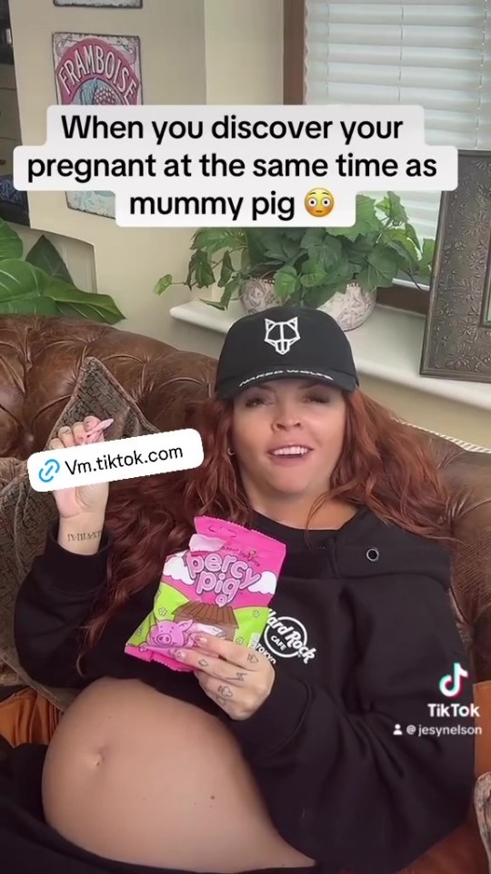 Pregnant Jesy Nelson holding Percy Pigs sweets.