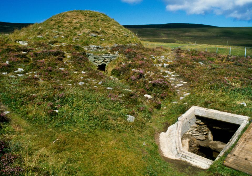 Taversoe Tuick Neolithic chambered cairn with double-decker burial chamber and miniature one.