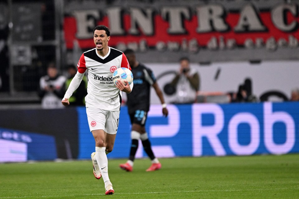 Hugo Ekitike celebrating a goal during a Bundesliga soccer match.