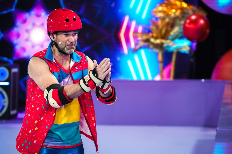 Man in roller skating gear during Red Nose Day fundraiser.