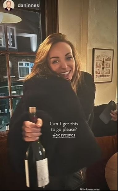 Helen George holding a bottle of wine, asking "Can I get this to go please? #yesyesyes"