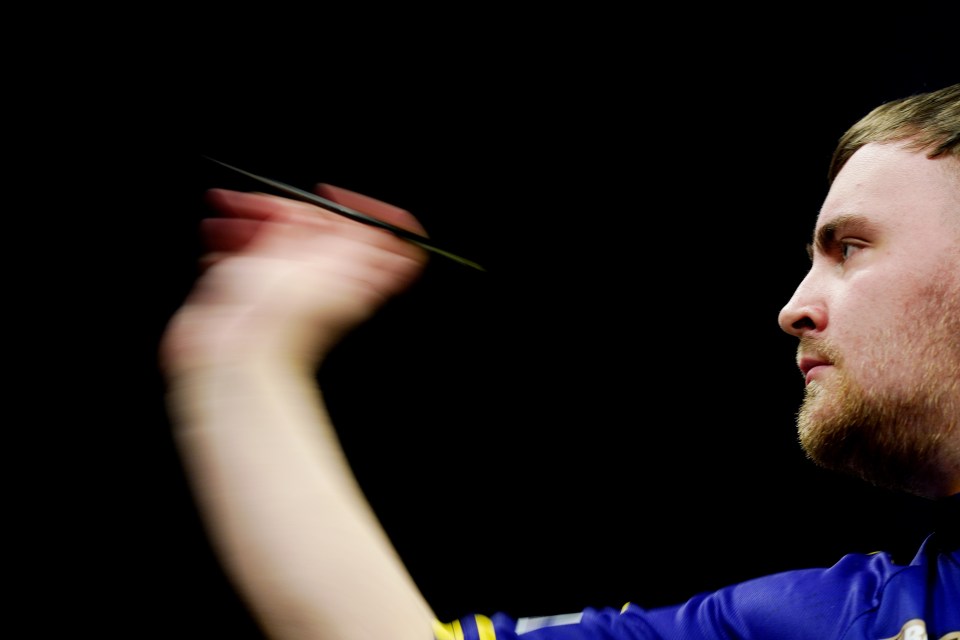 Luke Littler in action against Nathan Aspinall during night seven of the BetMGM Premier League at Utilita Arena, Cardiff. Picture date: Thursday March 20, 2025. PA Photo. See PA story DARTS Cardiff. Photo credit should read: David Davies/PA Wire. RESTRICTIONS: Use subject to restrictions. Editorial use only, no commercial use without prior consent from rights holder.