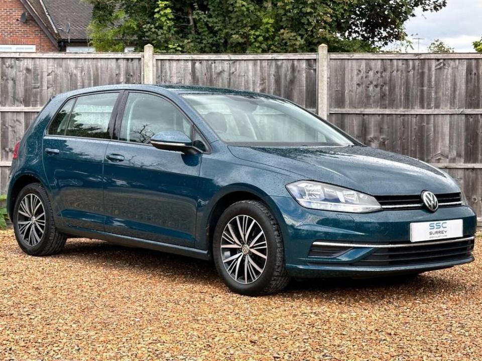 Dark teal Volkswagen Golf.