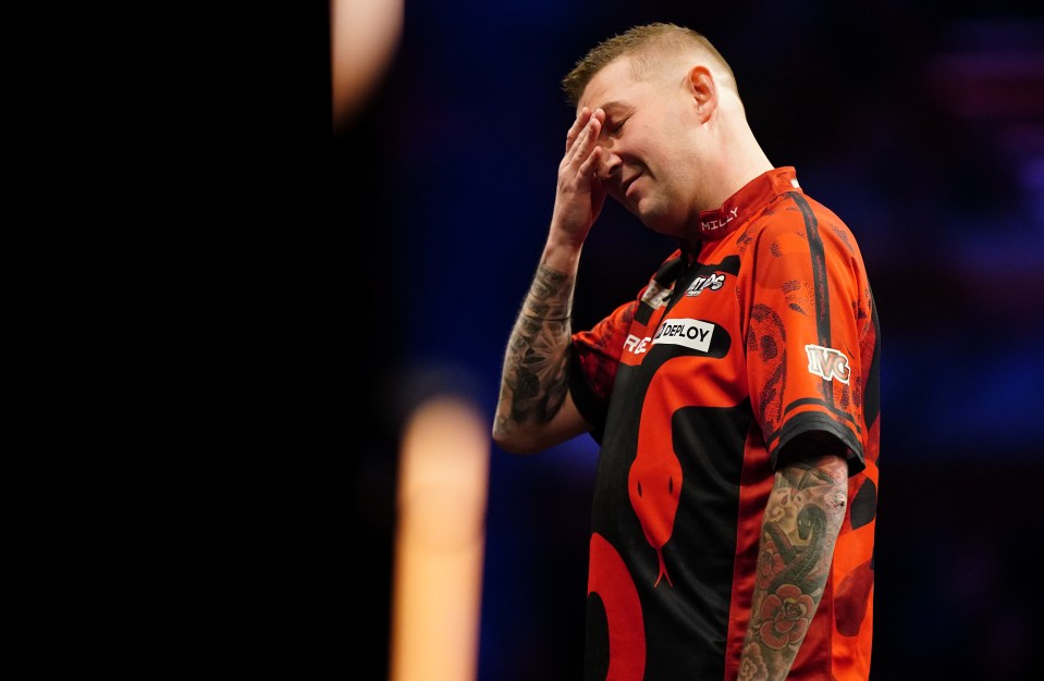 Nathan Aspinall at a darts match.