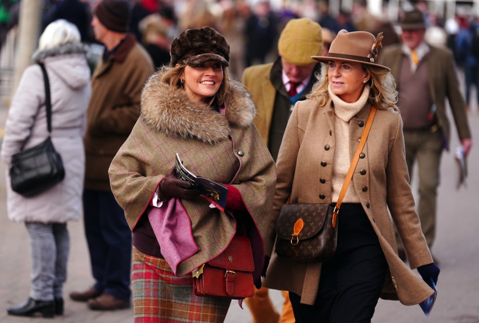 Two women at a horse race.
