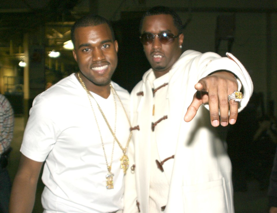 Kanye West and Sean "Diddy" Combs at a concert.