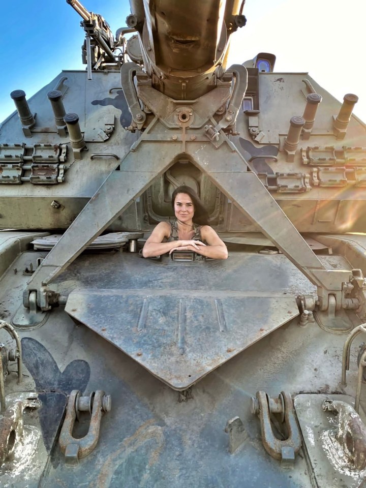 Anna Prokofyeva, a Russian state media journalist, sitting in a military vehicle.