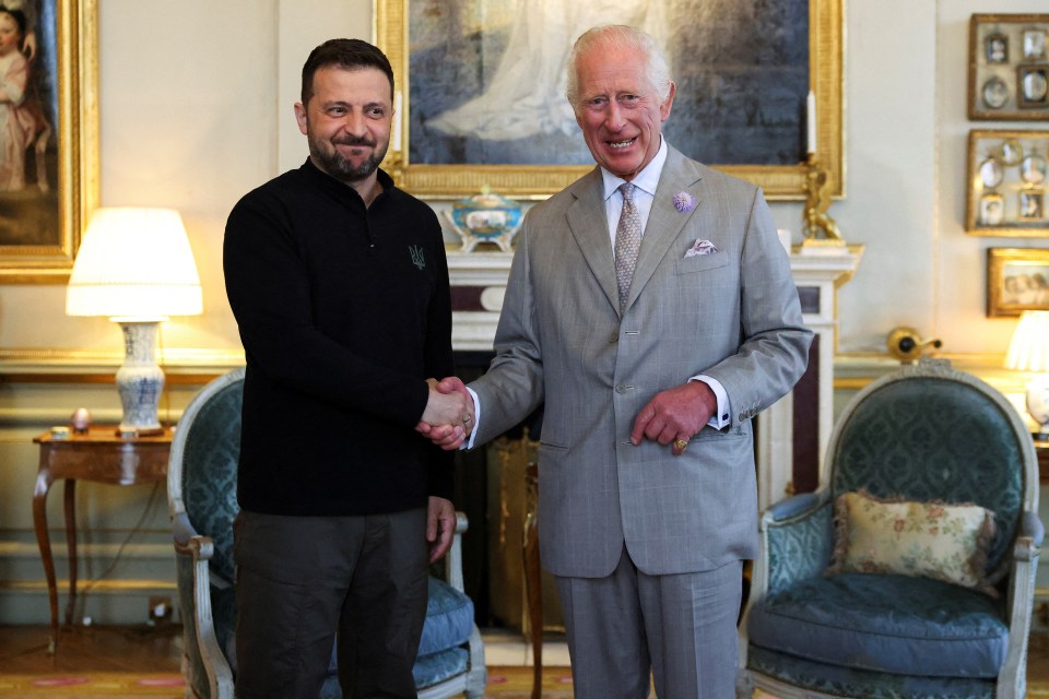 King Charles III shaking hands with President Volodymyr Zelensky.