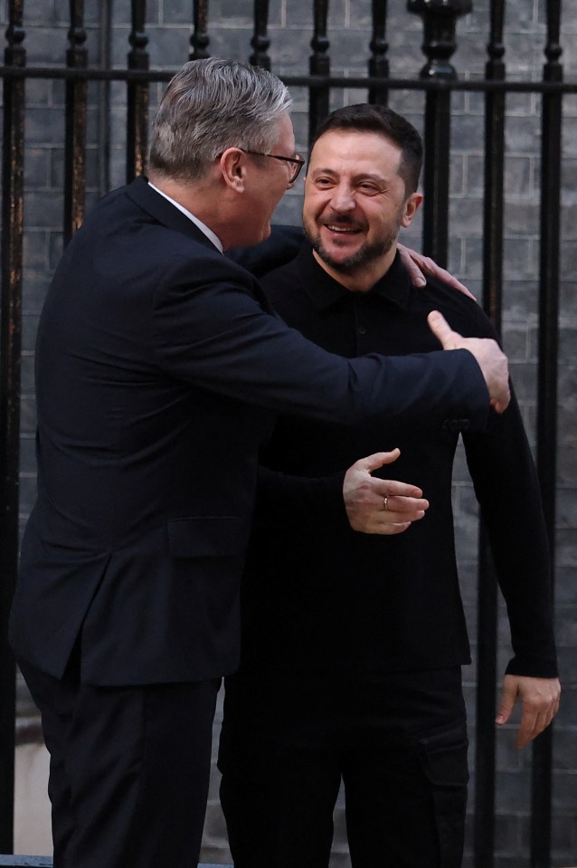 Keir Starmer and Volodymyr Zelenskiy embracing.