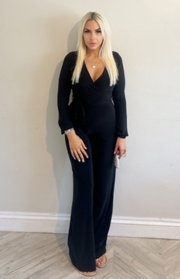 Woman in black jumpsuit.