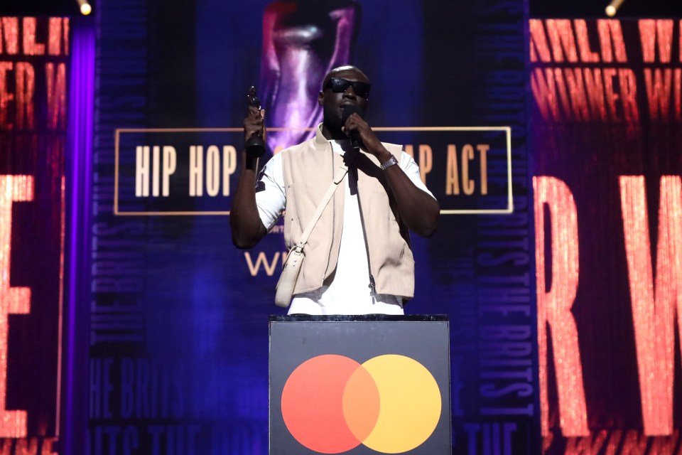 Stormzy accepting a Hip Hop/Grime/Rap Act award at The BRIT Awards.