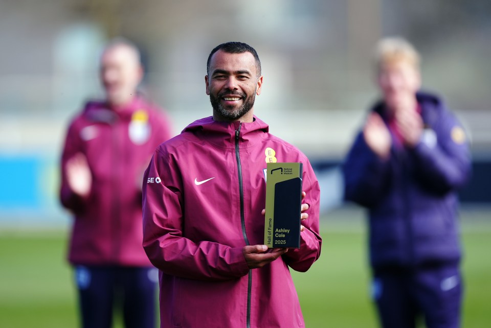 Ashley Cole holding his National Football Museum Hall of Fame award.