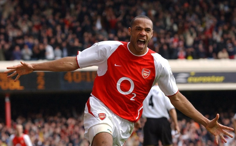Thierry Henry celebrating a goal during a Liverpool vs Arsenal match.