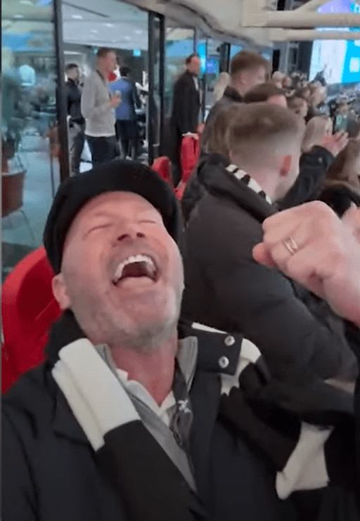 Man laughing on a bus.