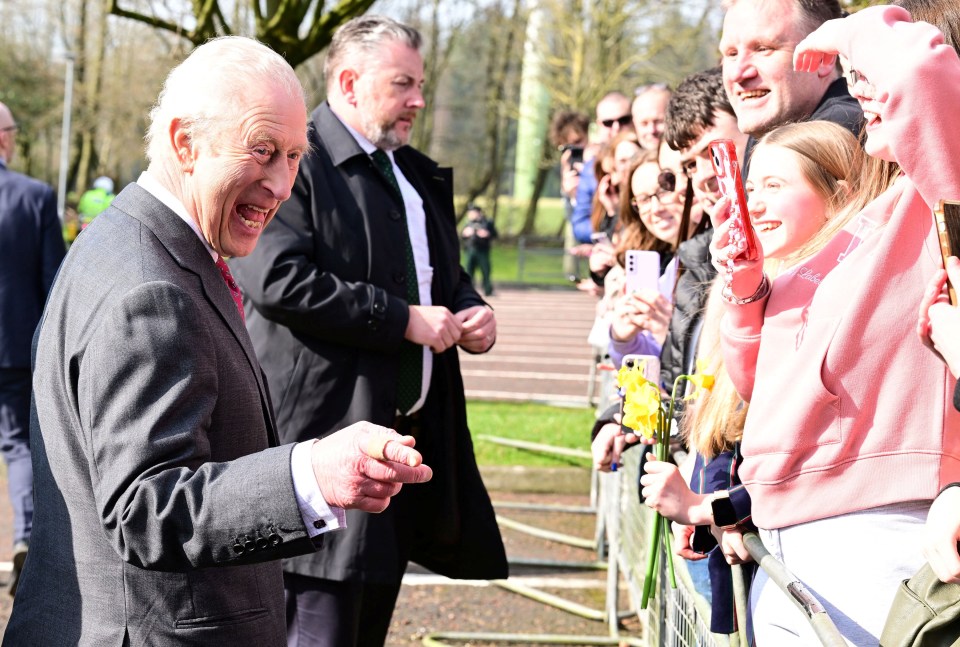King Charles III greets well-wishers.