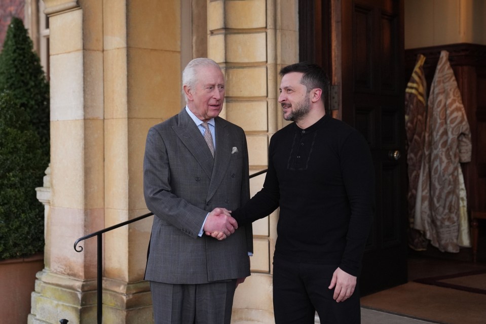 King Charles III shaking hands with Ukrainian President Volodymyr Zelensky.