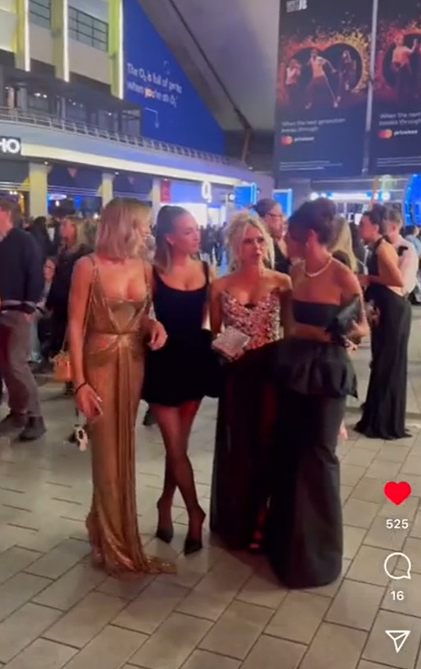 Four women at a formal event.