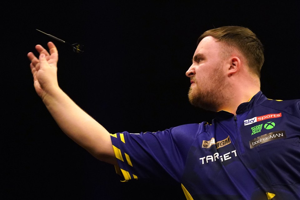 Luke Littler throwing a dart at the BetMGM Premier League.