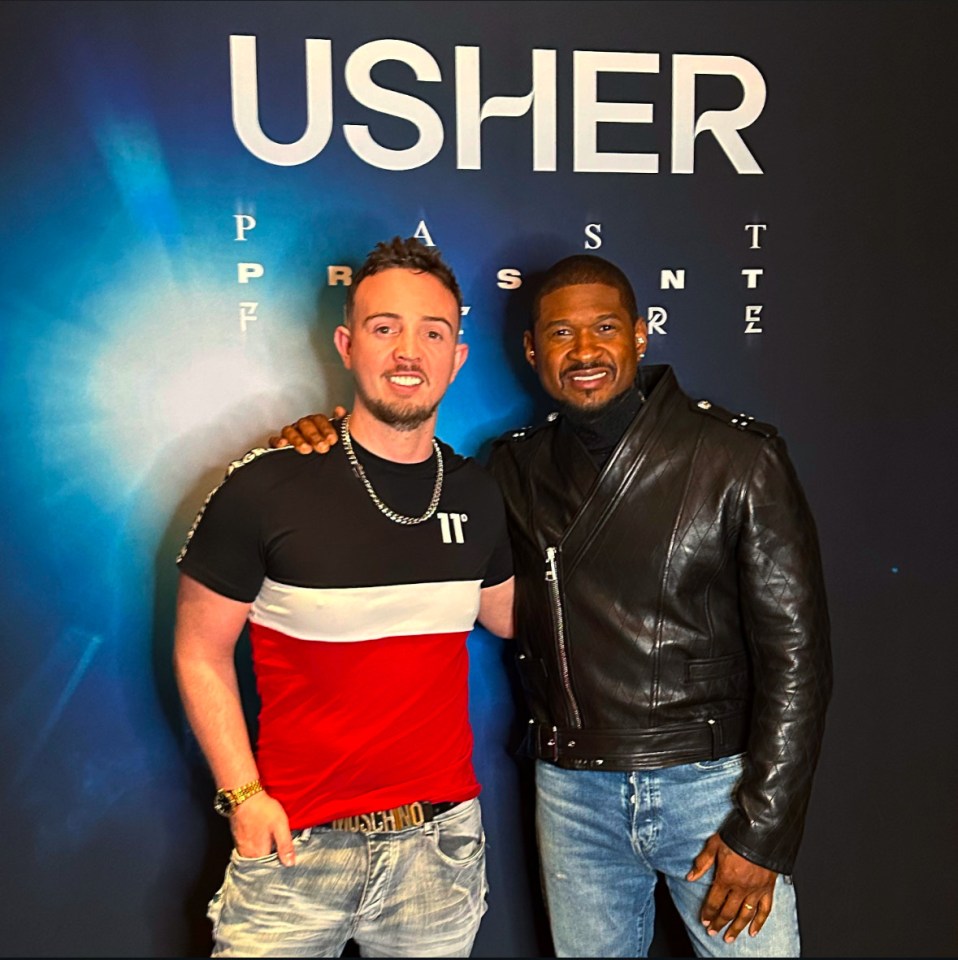 Usher and Jack Hardwick posing for a photo.